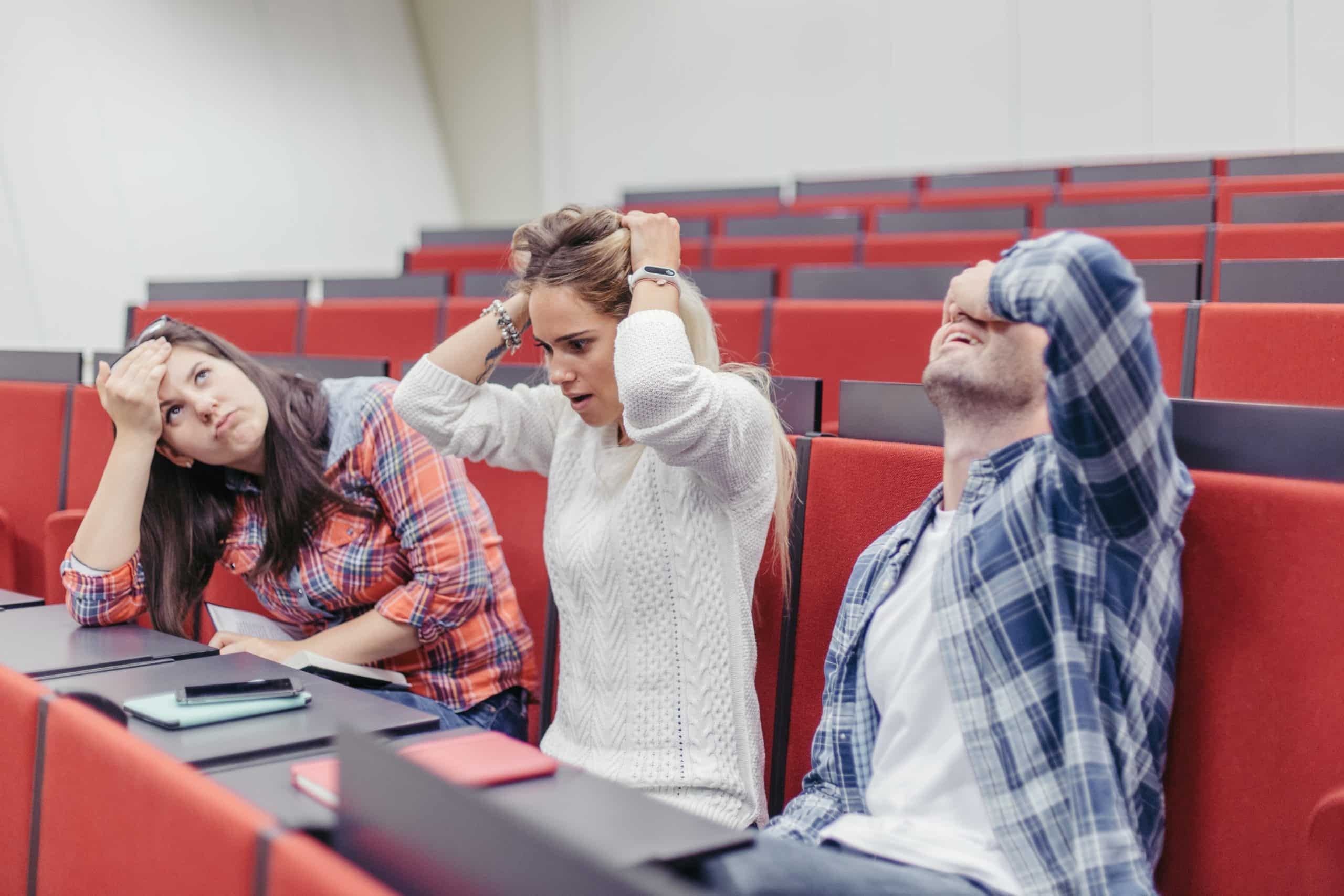 students holding heads during lesson scaled 1